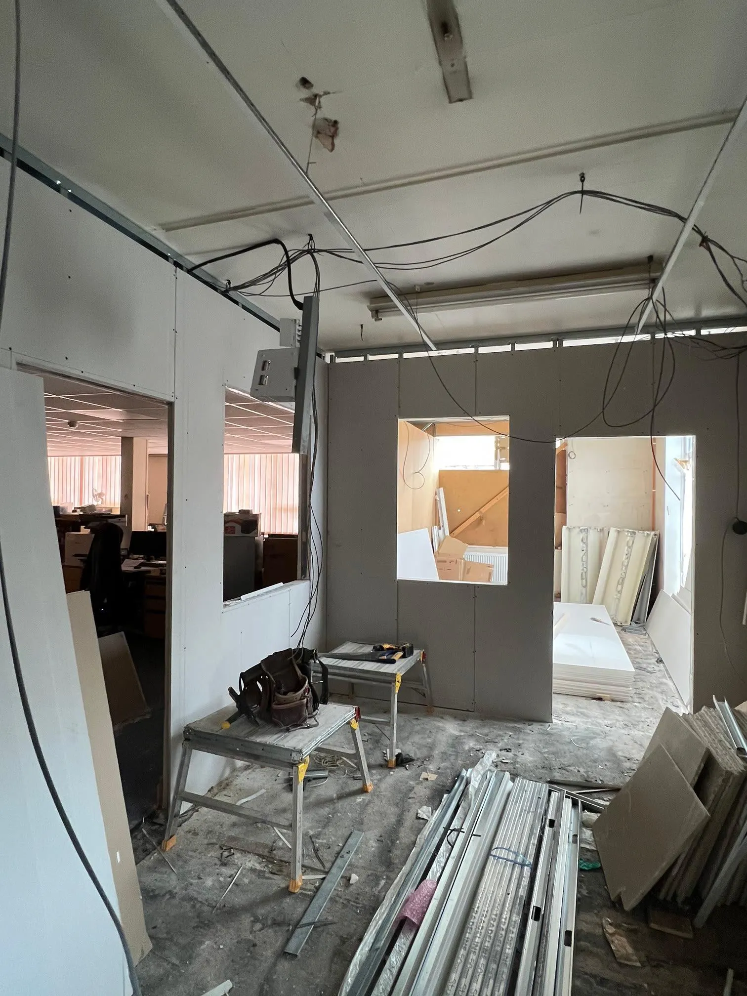A room that is being remodeled with a lot of wood.